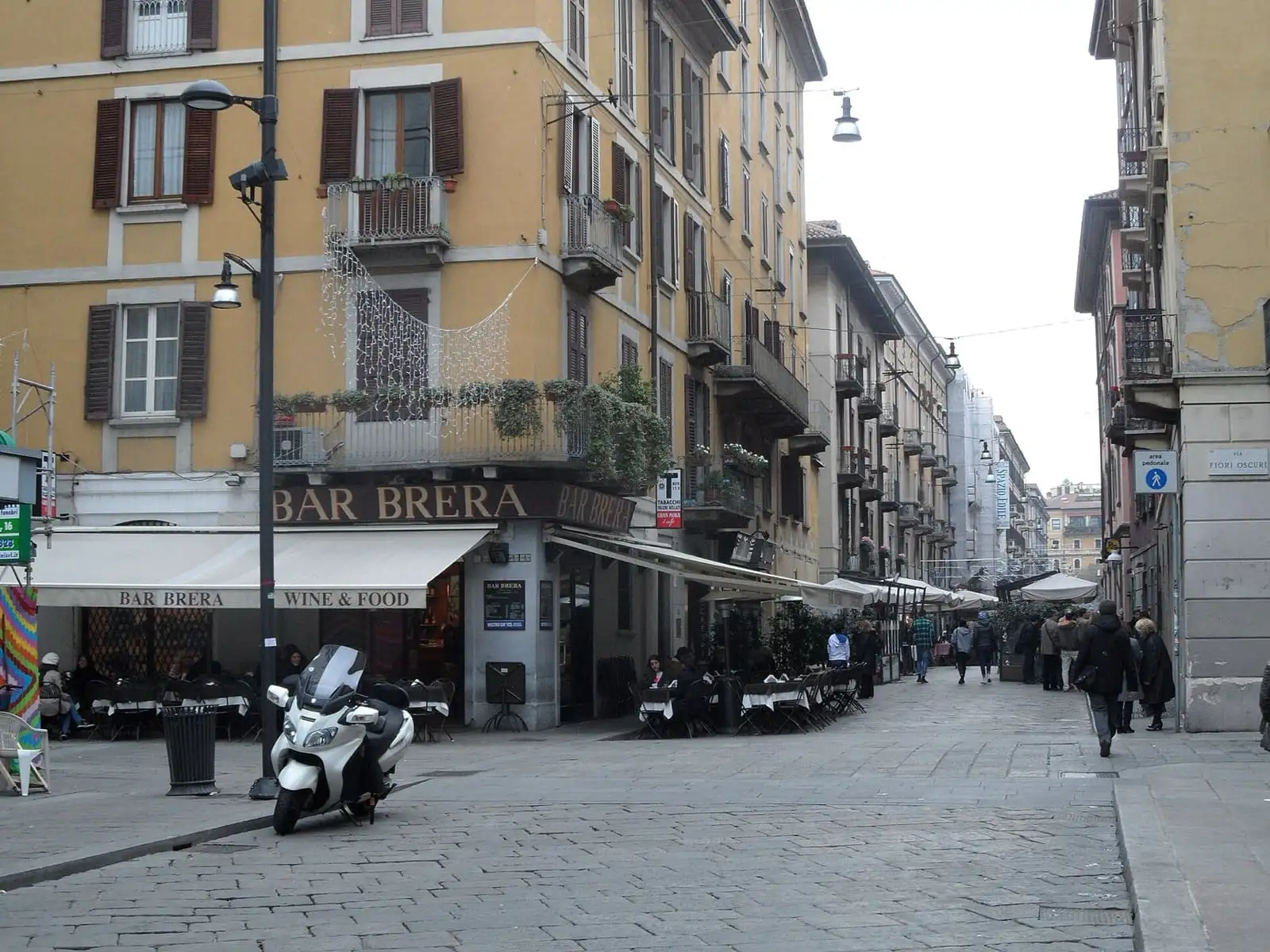 Pedestrian street in the Brera district with cafe tables outside Bar Brera