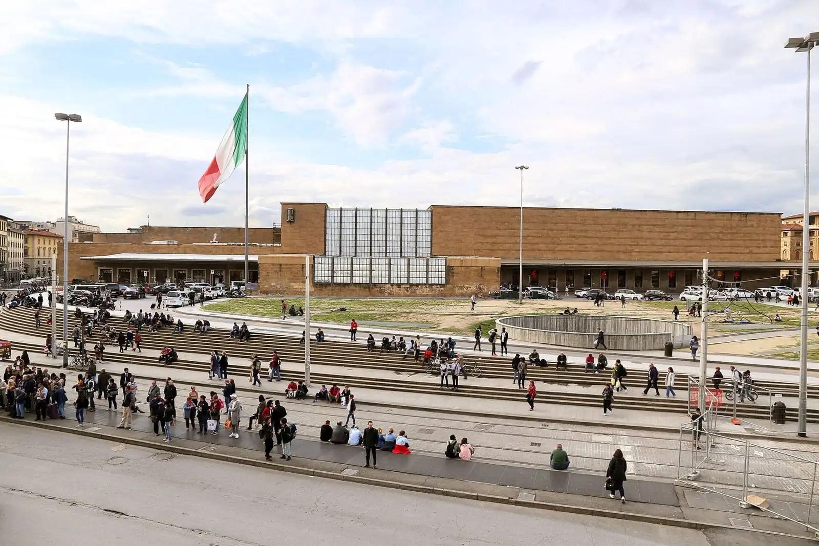 Long low facade of Firenze Santa Maria Novella railway station and its forecourt, seen from above
