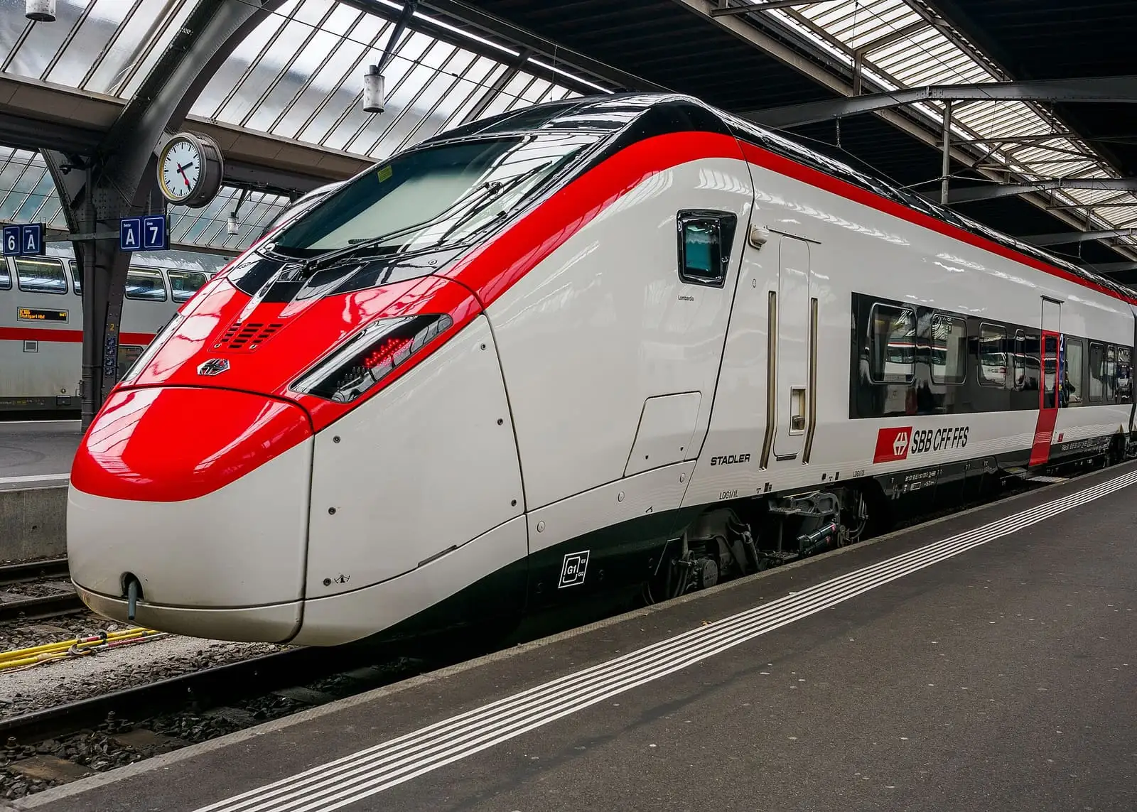 Red and white SBB Giruno high-speed train at a platform in Zurich main station