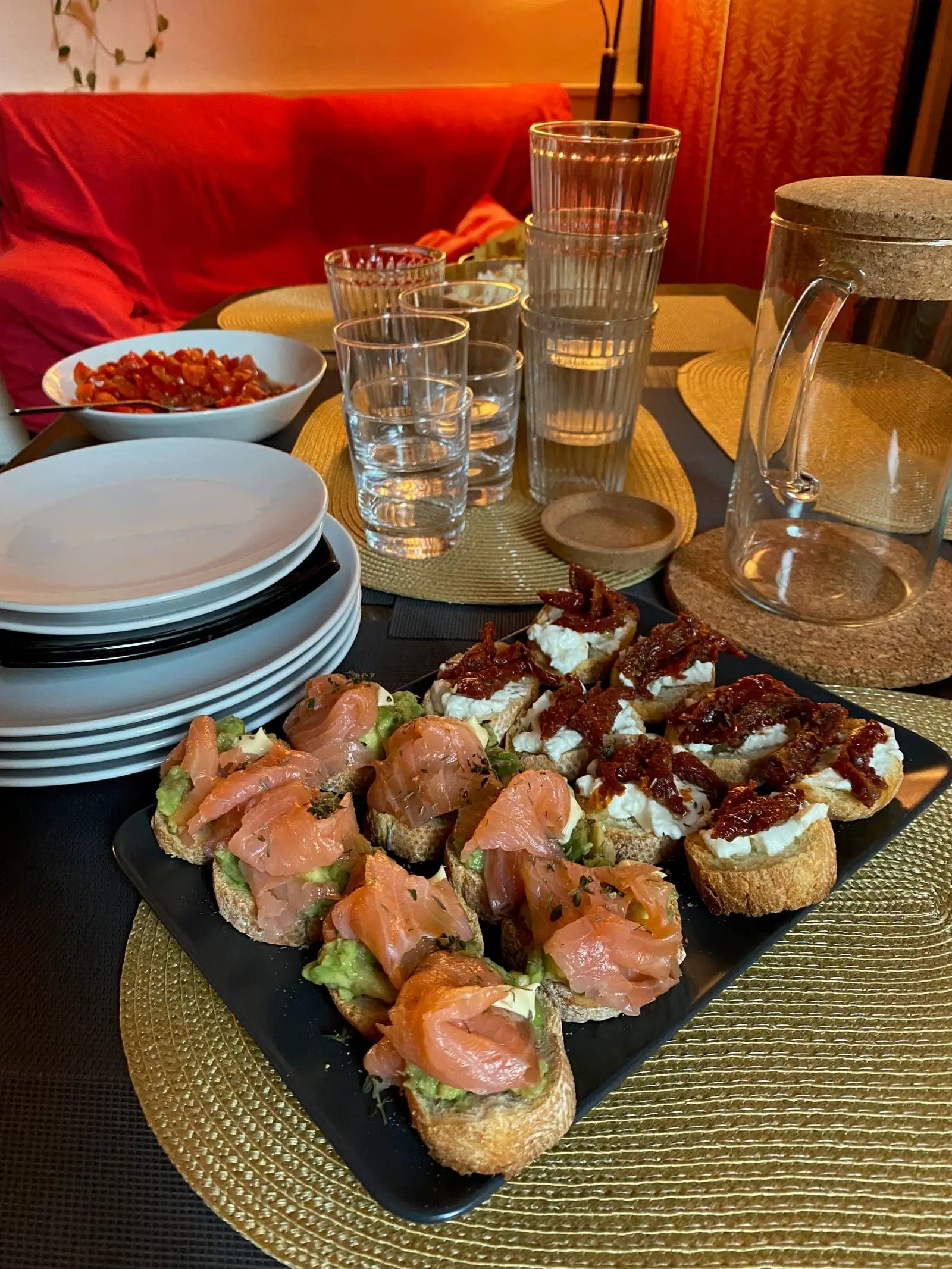 An aperitivo spread of small toasts and snacks on a table