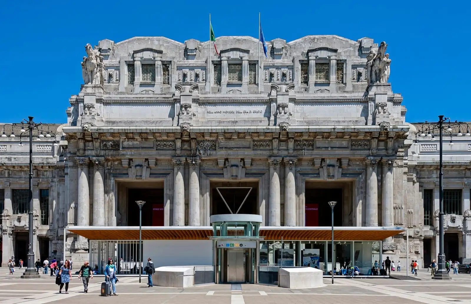 Monumental stone facade of Milano Centrale railway station