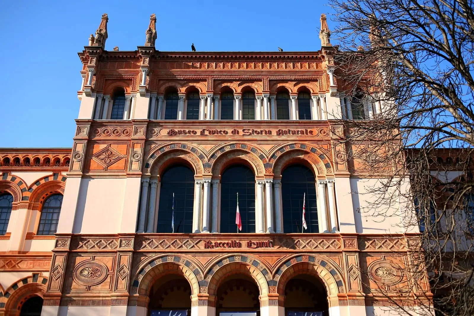 The red brick neo-Romanesque facade of the Natural History Museum in Milan