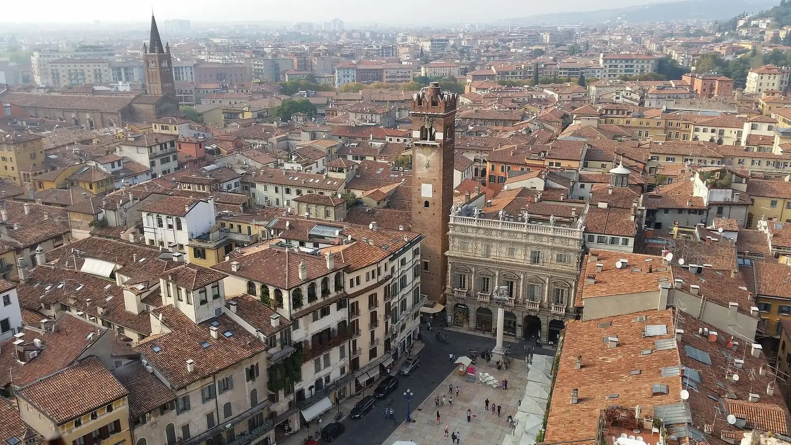 Piazza delle Erbe in Verona seen from above, surrounded by terracotta roofs