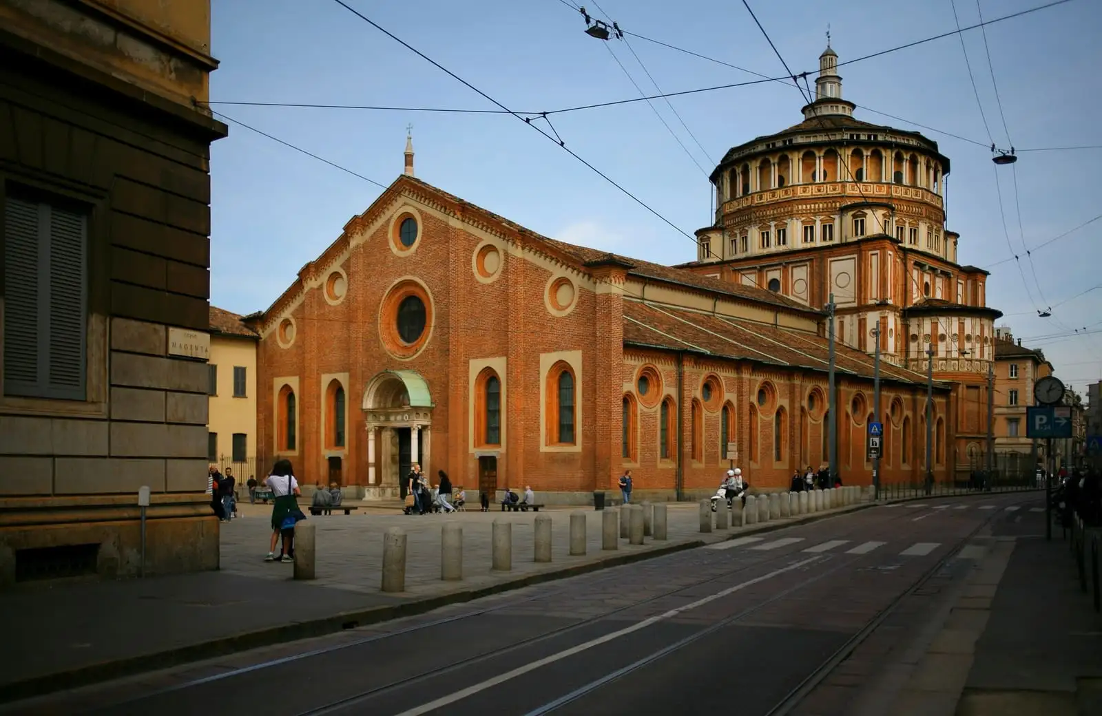 Brick facade and Bramante dome of Santa Maria delle Grazie church in Milan