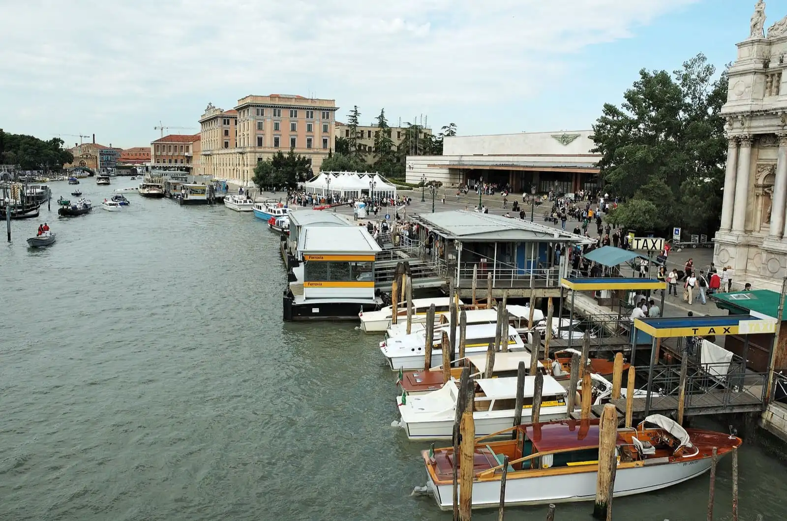 Grand Canal in Venice west of the Scalzi bridge, with water bus stops and Santa Lucia railway station on the right