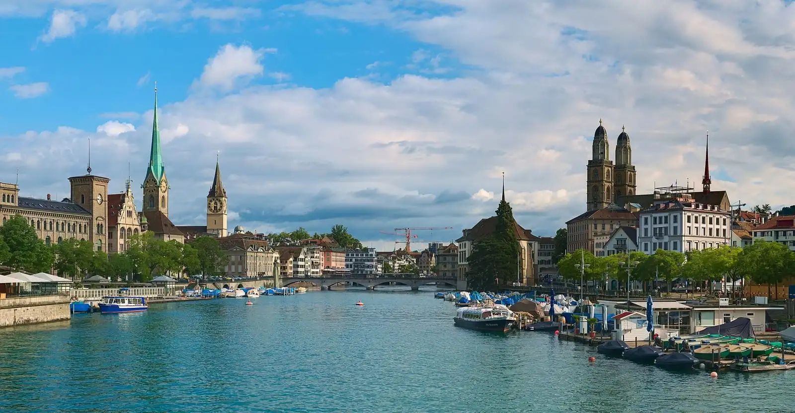 The Limmat river in Zurich with the towers of Fraumünster, St. Peter and Grossmünster